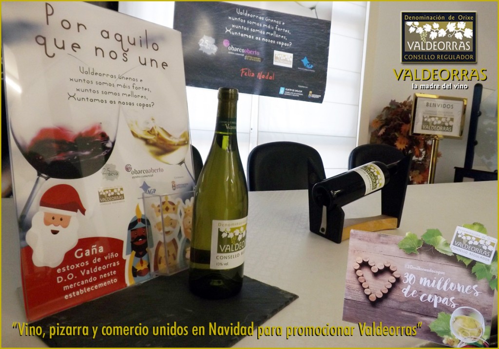 Cartel promocional e botellas que se poderán ver nos escaparates dos comercios de Valdeorras asociados a AEVA